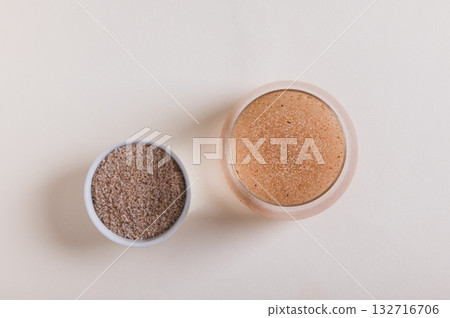 Close up of a glass of water and psyllium husk on the table for health  top view 132716706