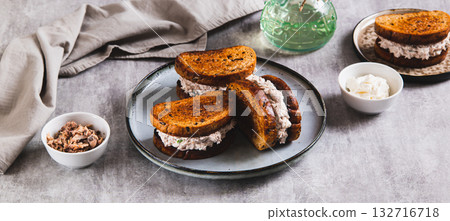Ricotta and tuna salad on a grain bread burger on a plate on a table web baanner Ricotta and tuna salad on a grain bread burger on a plate on a table web baanner 132716718
