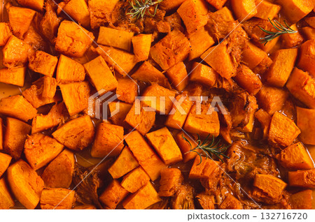 Baked pumpkin cubes on a baking sheet top view Baked pumpkin cubes on a baking sheet top view 132716720