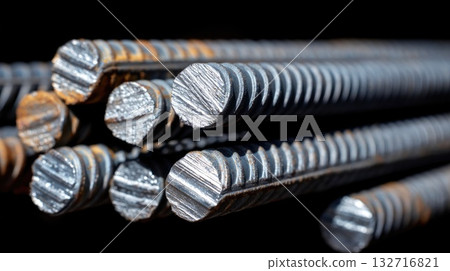 Close-up of shiny metal rebars with detailed texture and industrial background Close-up of shiny metal rebars with detailed texture and industrial background 132716821