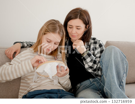 Happy Little Girl Sewing With Needle And Thread On Hoop With Mother Happy Little Girl Sewing With Needle And Thread On Hoop With Mother 132716959