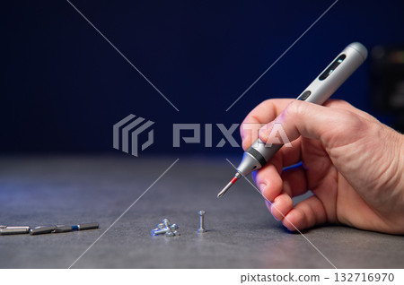 Electric mini screwdriver and several different interchangeable bits 132716970