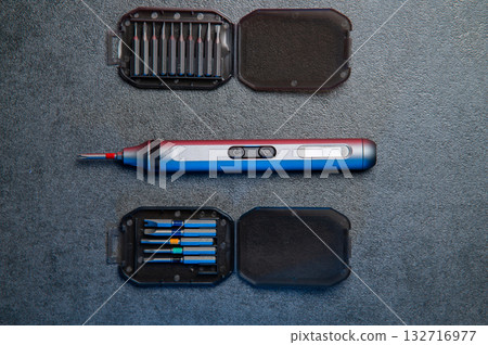 Electric mini screwdriver and several different interchangeable bits Electric mini screwdriver and several different interchangeable bits 132716977