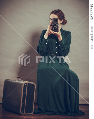 Woman retro style with old suitcase camera Woman retro style with old suitcase camera 132717745