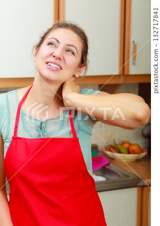 Overworked woman suffering from neck pain. 132717841