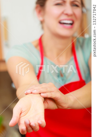 Woman checking pulse on wrist. Woman checking pulse on wrist. 132717842