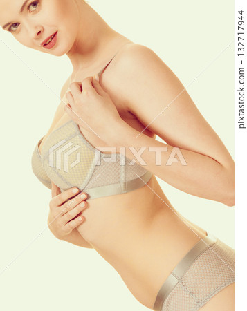 Attractive slim woman in grey matching underwear Attractive slim woman in grey matching underwear 132717944