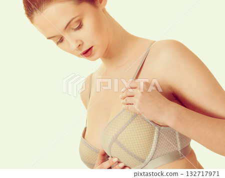 Attractive slim woman in grey matching underwear 132717971