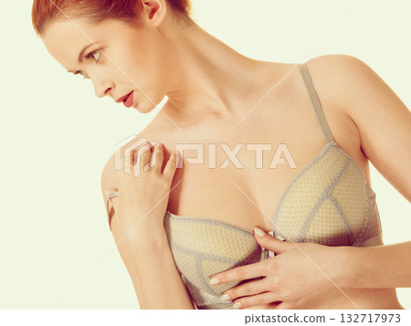 Attractive slim woman in grey matching underwear Attractive slim woman in grey matching underwear 132717973