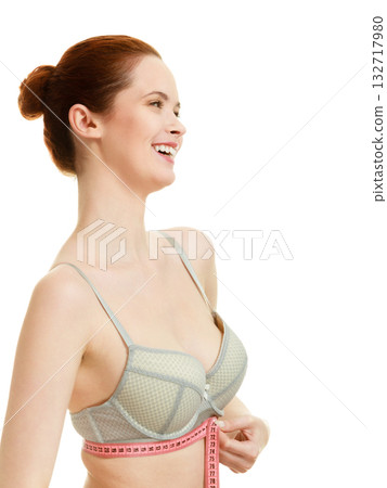 Woman measuring her under breasts. 132717980