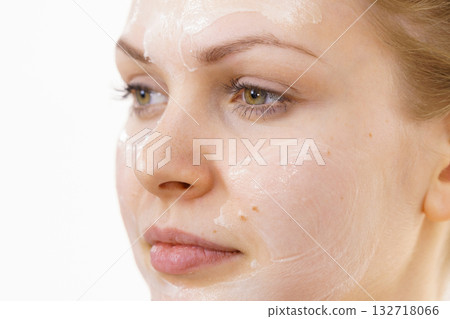 Girl with cream moisture cosmetic on face 132718066