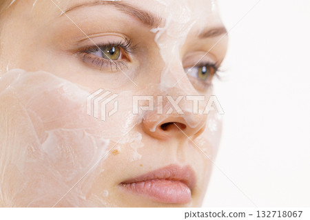 Girl with cream moisture cosmetic on face 132718067