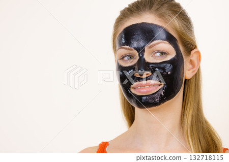 Girl black carbo peel off mask on face Girl black carbo peel off mask on face 132718115