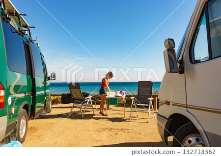 Woman wash dishes in bowl, capming outdoor 132718362