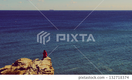 Tourist woman on sea cliffs in Spain Tourist woman on sea cliffs in Spain 132718374