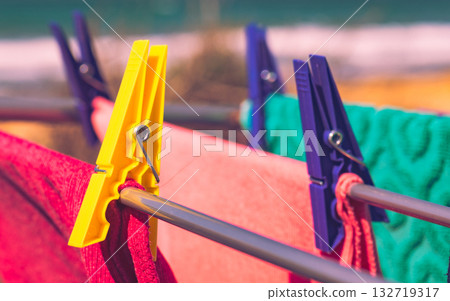 Clothes hanging to dry outdoor on sea coast 132719317