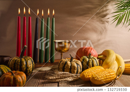 Kwanzaa. African holiday Kwanzaa with decoration of seven candles and pumpkins 132719330