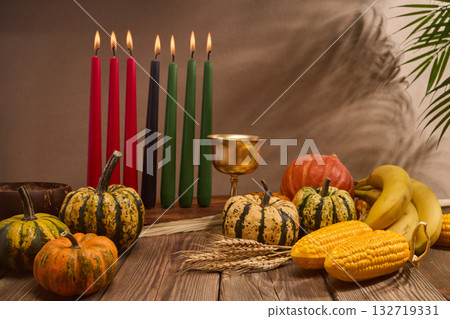 Kwanzaa. African holiday Kwanzaa with decoration of seven candles and pumpkins 132719331