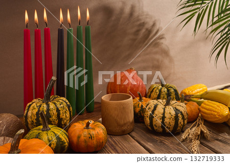 Kwanzaa. African holiday Kwanzaa with decoration of seven candles and pumpkins 132719333