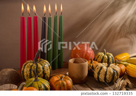 Kwanzaa. African holiday Kwanzaa with decoration of seven candles and pumpkins 132719335