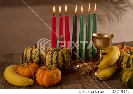 Kwanzaa. African holiday Kwanzaa with decoration of seven candles and pumpkins Kwanzaa. African holiday Kwanzaa with decoration of seven candles and pumpkins 132719342
