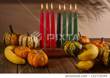 Kwanzaa. African holiday Kwanzaa with decoration of seven candles and pumpkins 132719344