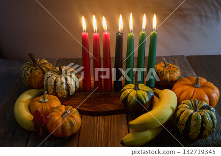 Kwanzaa. African holiday Kwanzaa with decoration of seven candles and pumpkins 132719345