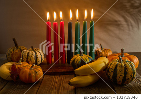 Kwanzaa. African holiday Kwanzaa with decoration of seven candles and pumpkins 132719346