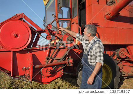 Farm worker and agricultural equipment Farm worker and agricultural equipment 132719367
