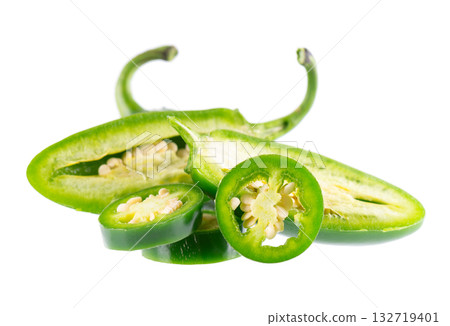 Fresh jalapeno pepper isolated on white background. Slices of green hot serrano pepper. Clipping path. Fresh jalapeno pepper isolated on white background. Slices of green hot serrano pepper. Clipping path. 132719401