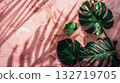 Tropical green leaves on pink marble background 132719705