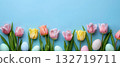 Easter tulips and pastel eggs on blue background 132719711