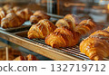 Freshly baked croissants on tray in bakery 132719712