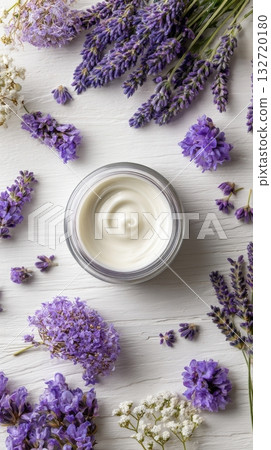 Lavender Flowers Surround a Jar of Cream on a Rustic Wooden Surface in Natural Light 132720180