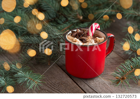 Christmas hot chocolate, coffee or cacao with marshmallows and candy cane. Xmas festive cozy beverage. Traditional beverage for kids. 132720573
