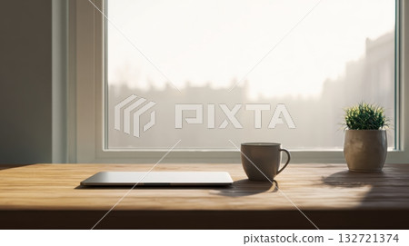 Laptop And Coffee Mug On Wooden Desk By Window With Potted Plant. Minimalist Workspace With Natural Light 132721374