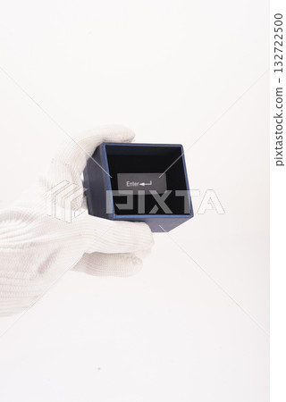 Red employee icon standing out among black user icons on a computer keyboard. Recruitment, hiring or target audience concept. 132722500