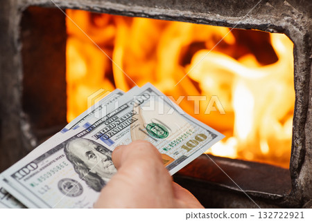 Spending a lot of money for heating the house due to economic and political crisis in the world. Heating the house with the help of solid fuel boiler, spending much money concept Spending a lot of money for heating the house due to economic and political crisis in the world. Heating the house with the help of solid fuel boiler, spending much money concept 132722921
