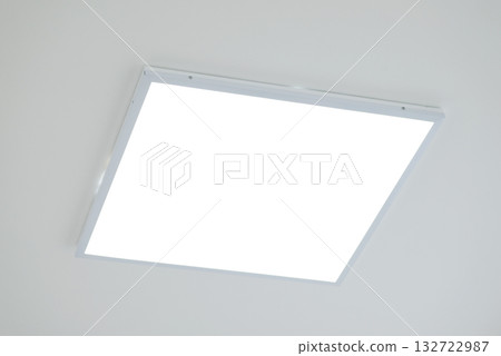 Close up shot of LED light on ceiling. White panel of modern LED light on the ceiling in office Close up shot of LED light on ceiling. White panel of modern LED light on the ceiling in office 132722987