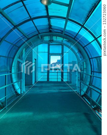 Inside a closed pedestrian bridge over a road. 132723060