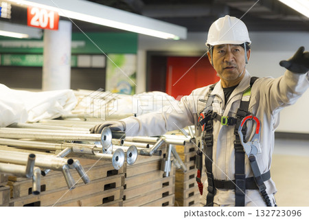 Worker wearing a full harness Worker wearing a full harness 132723096
