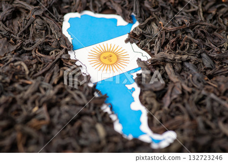 Concept of growing tea in Argentina. Argentina map and flag, dried tea leaves around 132723246