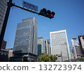 [Japan] High-rise office buildings in front of the south exit of Tokyo Station, a red light and a clear blue sky 132723974