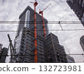 [Japan] A building under construction in Tokyo with an orange crane attached 132723981