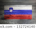 Slovenia flag on rustic old wood surface background 132724140