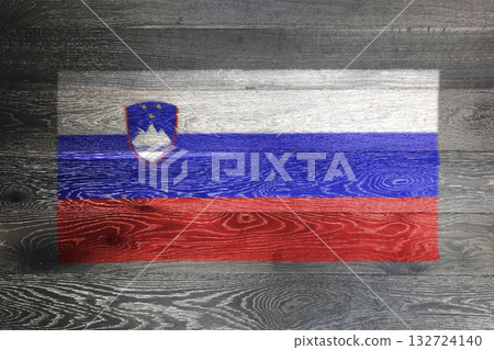 Slovenia flag on rustic old wood surface background Slovenia flag on rustic old wood surface background 132724140