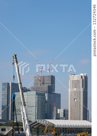 A view of a large crane and Minato Ward from Kachidoki 132724346