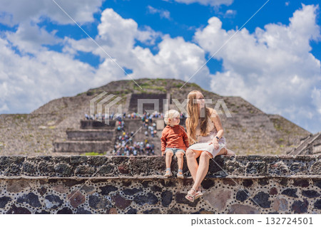 Mother and her son as tourists in front of Teotihuacan pyramids, Mexico, enjoying sightseeing, family travel, and cultural exploration together 132724501