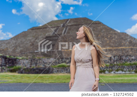 Female tourist standing in front of Teotihuacan pyramids in Mexico, enjoying sightseeing, adventure, and cultural heritage. Travel, tourism, and exploration concept Female tourist standing in front of Teotihuacan pyramids in Mexico, enjoying sightseeing, adventure, and cultural heritage. Travel, tourism, and exploration concept 132724502