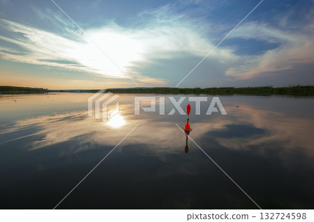 Morning fishing on the river. Fishing float in the lake among water. Angling tackle with a bobber 132724598